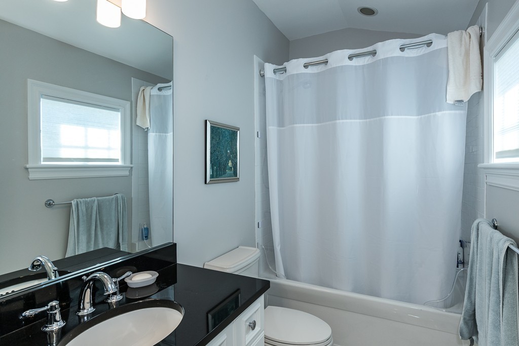 44 Peregrine Road Newton, MA 02459 - Photo 17 of 25 a bathroom with a sink toilet and shower