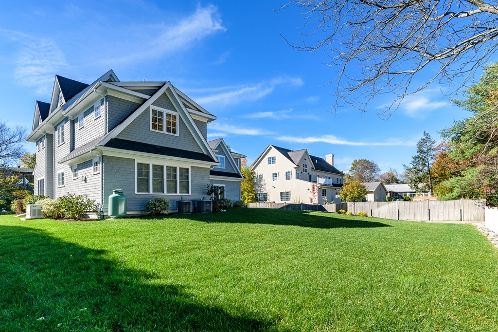 44 Peregrine Road Newton, MA 02459 - Photo 25 of 25 a front view of a house with a garden and trees
