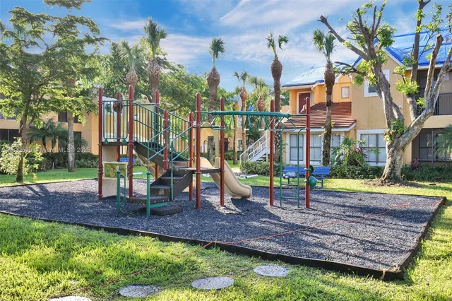 a view of a park with large trees