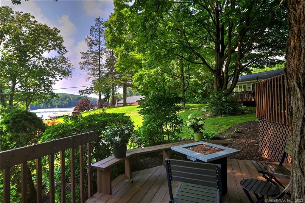 85 West Lake Road Trumbull, CT 06611 - Photo 1 of 1 a view of a table and chairs in the deck