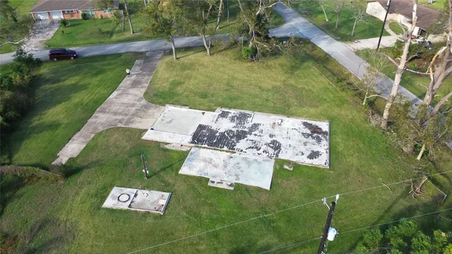 an aerial view of a house with outdoor space