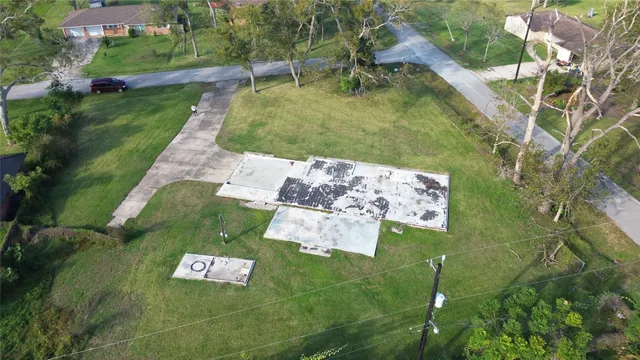an aerial view of residential house with outdoor space