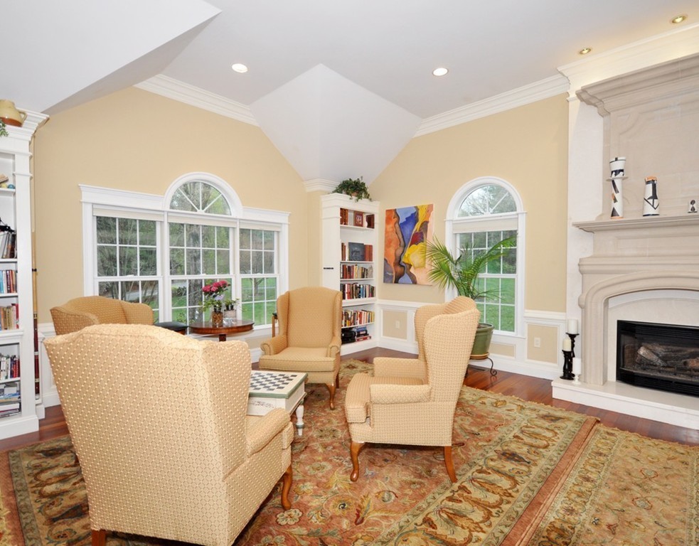 65 Summit Street Concord, MA 01742 - Photo 11 of 29 a living room with furniture a fireplace and a large window