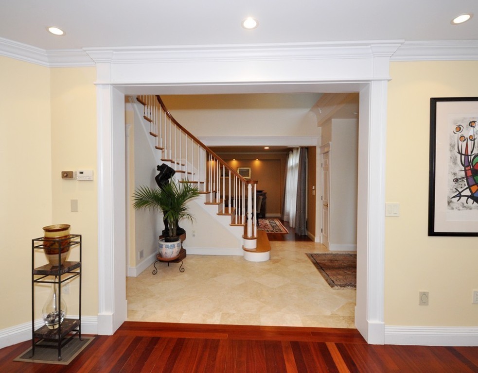 65 Summit Street Concord, MA 01742 - Photo 14 of 29 a view of a hallway with wooden floor and a living room