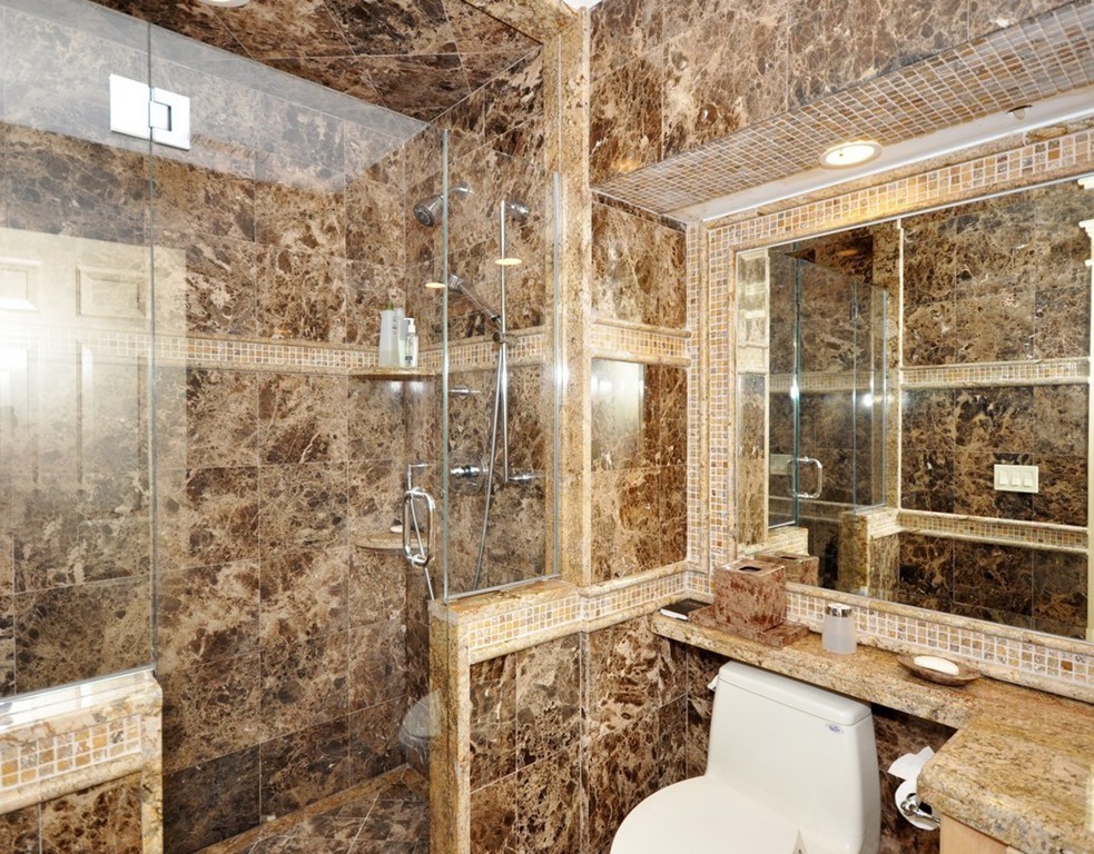 65 Summit Street Concord, MA 01742 - Photo 19 of 29 a bathroom with a sink mirror toilet and shower