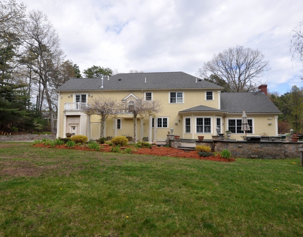 65 Summit Street Concord, MA 01742 - Photo 26 of 29 a front view of a residential houses with yard and trees