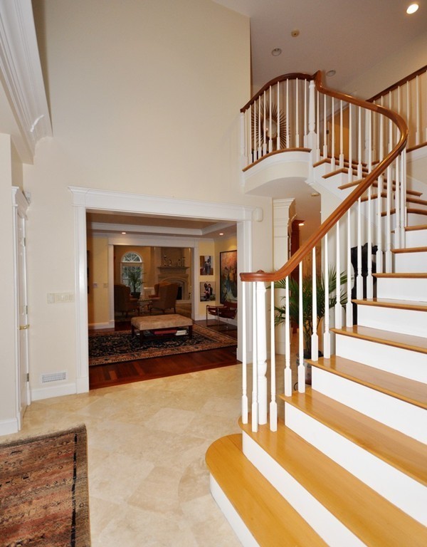 65 Summit Street Concord, MA 01742 - Photo 6 of 29 a view of staircase with white walls and a rug