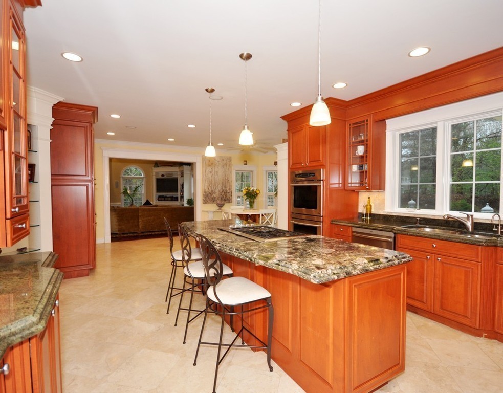 65 Summit Street Concord, MA 01742 - Photo 7 of 29 a kitchen with stainless steel appliances granite countertop a stove sink and cabinets