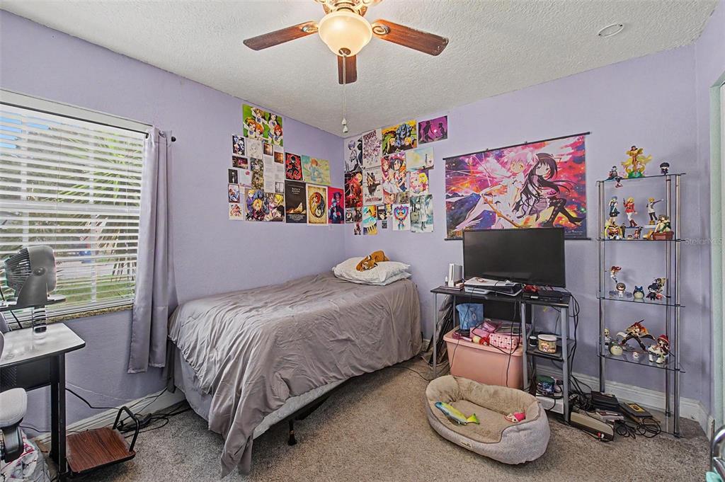 1632 Pintail Court Lutz, FL 33549 - Photo 24 of 34 a bedroom with bed and a window