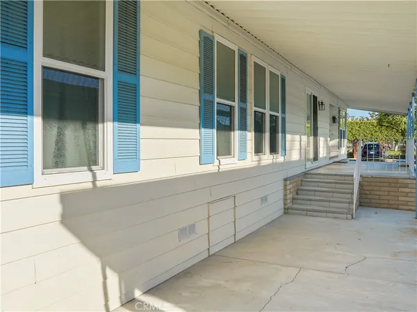 a view of a brick house with large windows