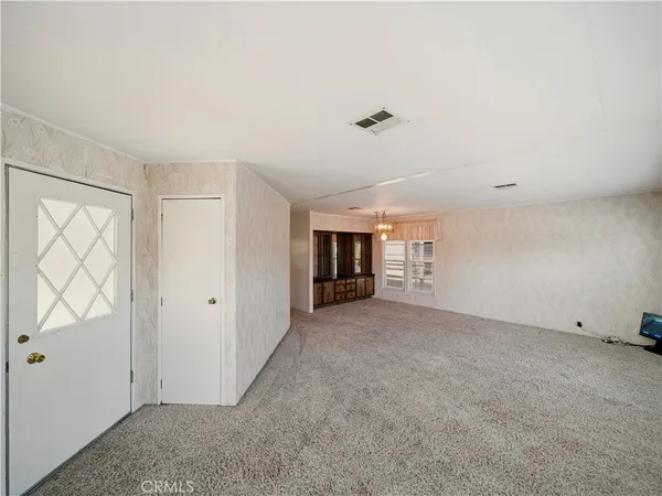 a view of a room and fire place