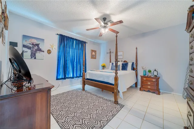 a bedroom with furniture and a mirror