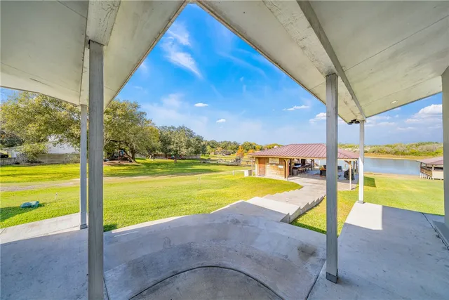 a view of a swimming pool with an outdoor seating