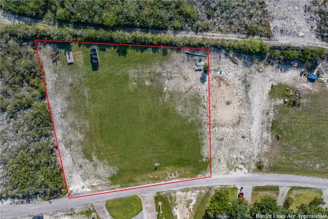 an aerial view of a house with outdoor space