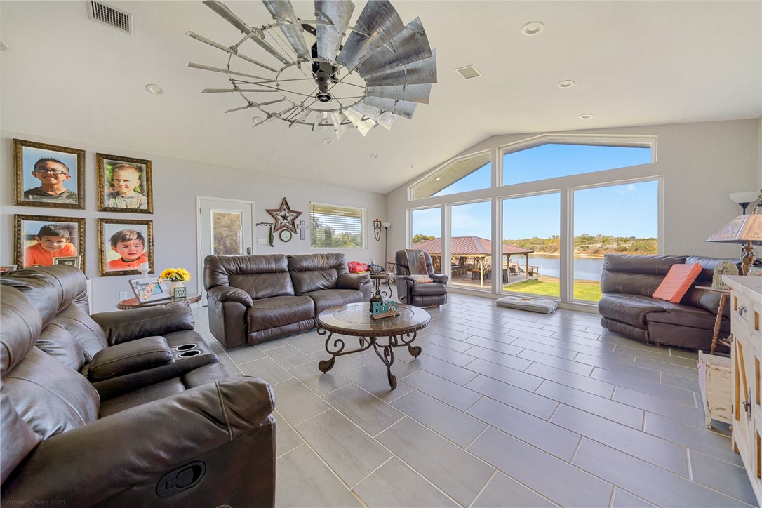 529 County Road 372 Sandia, TX 78383 - Photo 8 of 40 a living room with furniture or couch and a large window