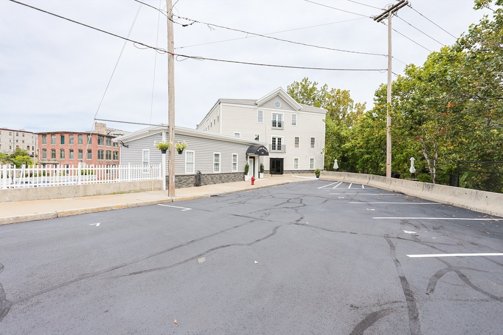 148 Bernon Street, Unit 19 Woonsocket, RI 02895 - Photo 20 of 20 a view of a house with a street