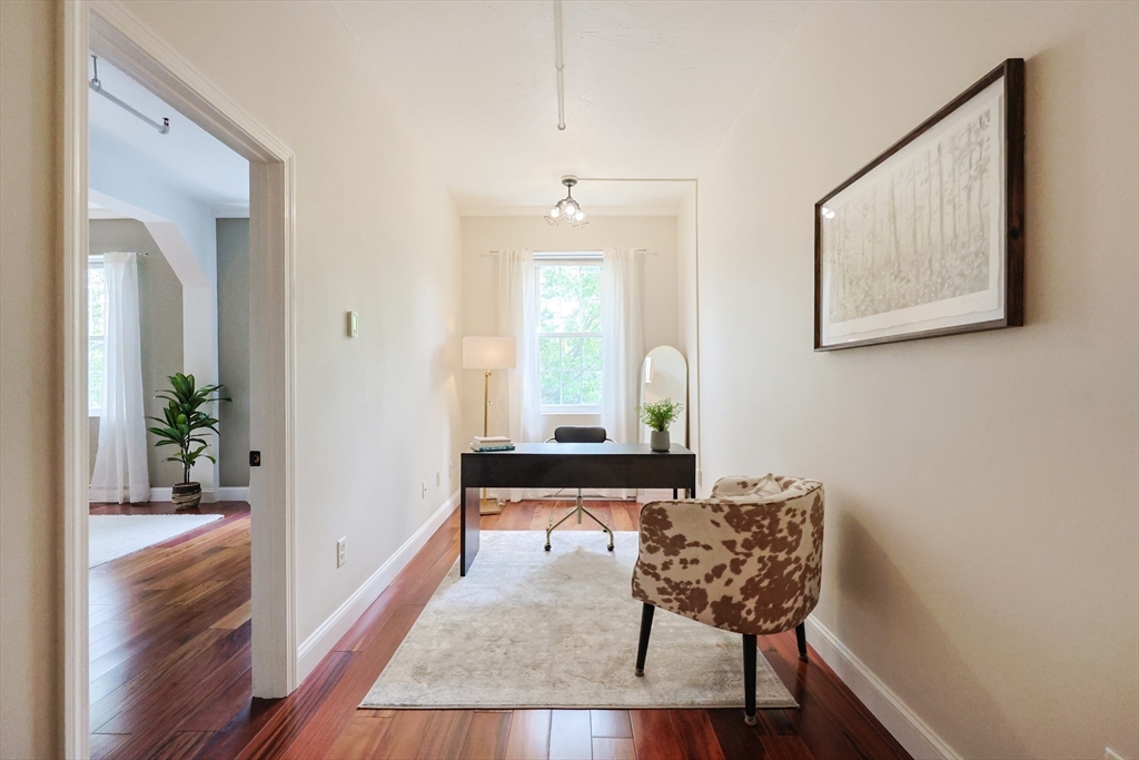 148 Bernon Street, Unit 19 Woonsocket, RI 02895 - Photo 9 of 20 a view of a hallway with furniture and wooden floor