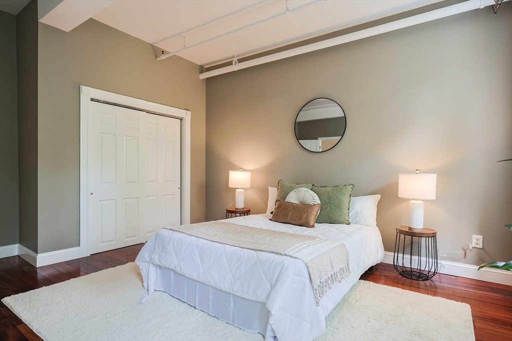 148 Bernon Street, Unit 19 Woonsocket, RI 02895 - Photo 10 of 20 a bedroom with a bed and a lamp