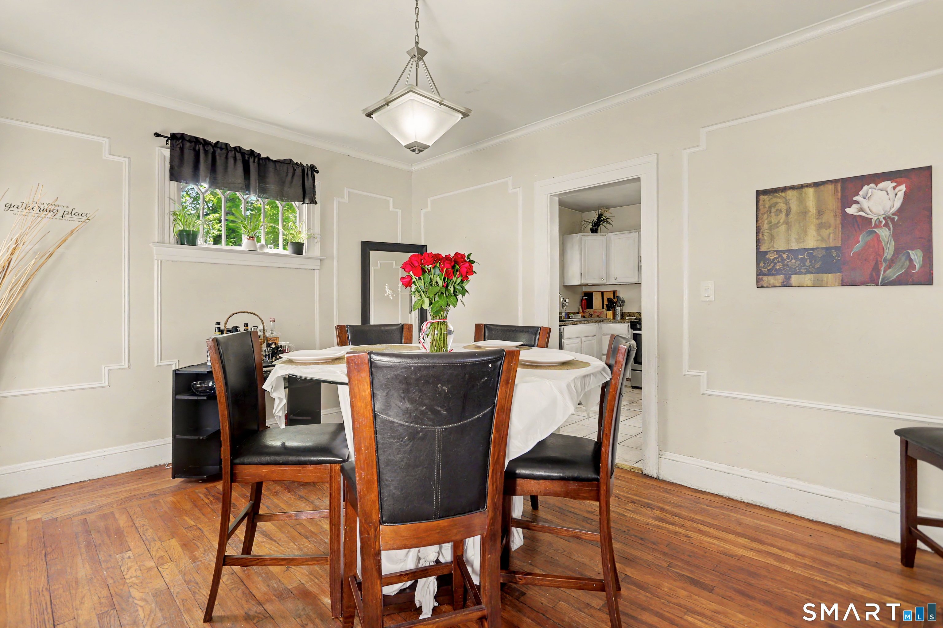 94 2nd Street Hamden, CT 06514 - Photo 11 of 31 a view of a dining room with furniture and wooden floor