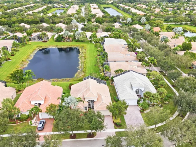 an aerial view of a house with yard swimming pool and outdoor seating