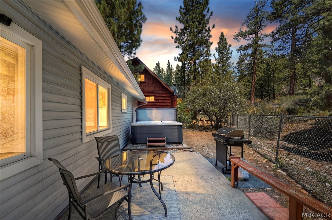 1099 Canyon Road Fawnskin, CA 92333 - Photo 35 of 39 a view of a house with backyard and sitting area