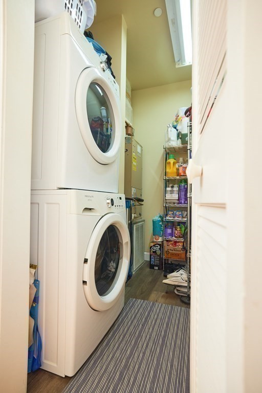 974 Main Street, Unit 34 Wakefield, MA 01880 - Photo 12 of 15 a view of a bedroom with washer and dryer