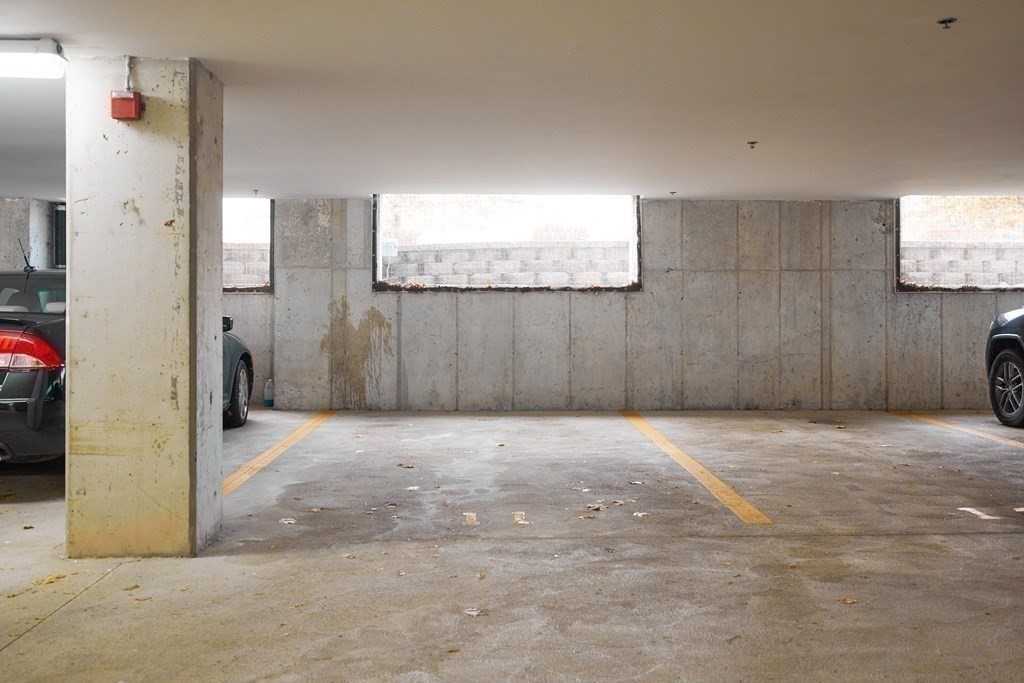 974 Main Street, Unit 34 Wakefield, MA 01880 - Photo 13 of 15 a view of a livingroom with wooden floor and cabinet
