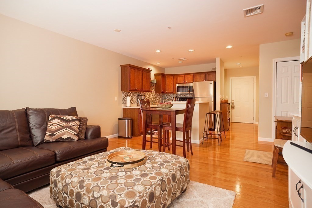 974 Main Street, Unit 34 Wakefield, MA 01880 - Photo 4 of 15 a living room with furniture and a table