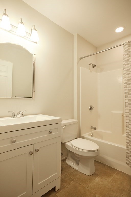 974 Main Street, Unit 34 Wakefield, MA 01880 - Photo 9 of 15 a bathroom with a sink a toilet and shower