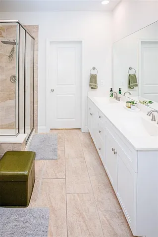 a bathroom with a bathtub and shower