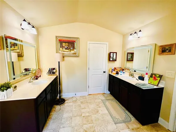 a view of a bathroom with sink and mirror