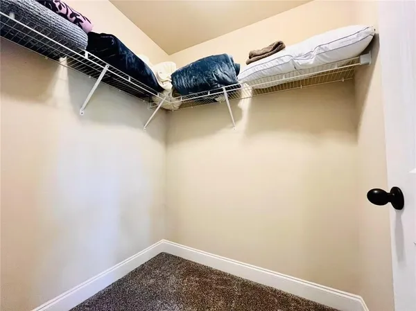 a view of a room with racks on the wall