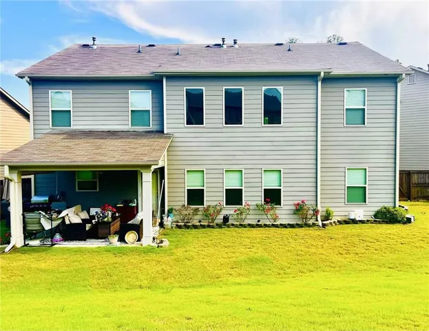 a view of a swimming pool with chairs