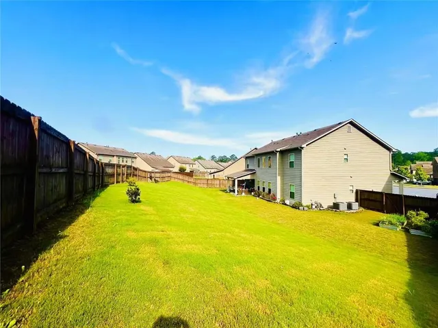a view of a swimming pool with an outdoor space and seating area