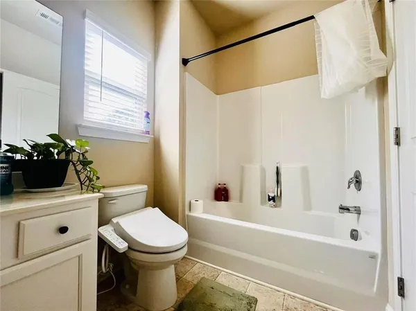 a bathroom with a sink a toilet and a bathtub