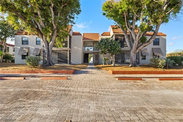 a view of the house with a yard