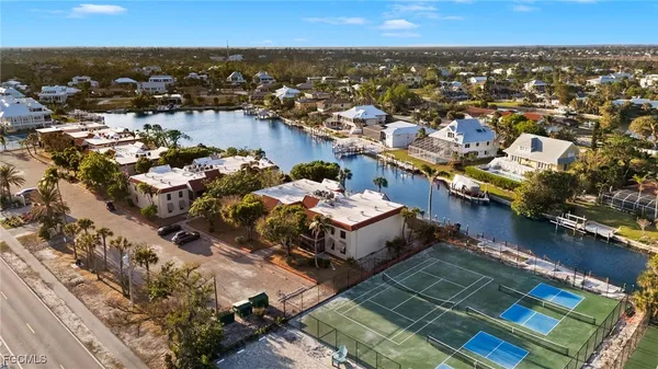 an aerial view of a house with a ocean view