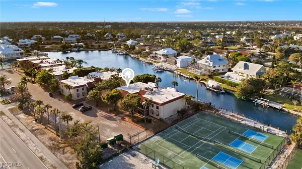 an aerial view of a house with a ocean view