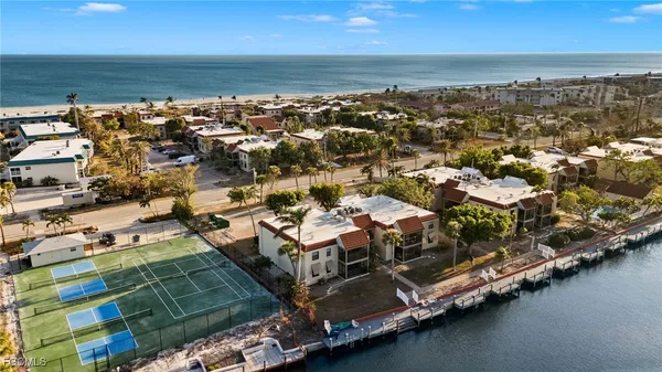 an aerial view of residential houses with outdoor space