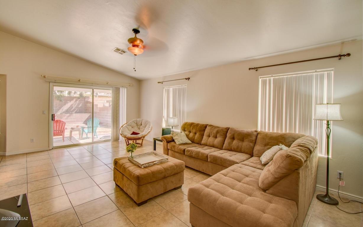 5311 West Fireopal Way Tucson, AZ 85742 - Photo 4 of 14 a living room with furniture and a large window