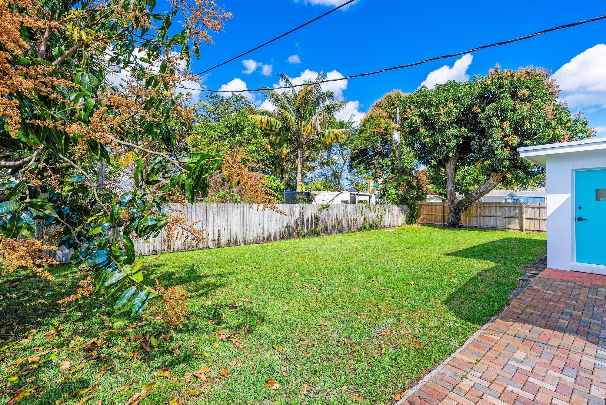 445 Monroe Drive West Palm Beach, FL 33405 - Photo 16 of 20 a view of a yard with a tree