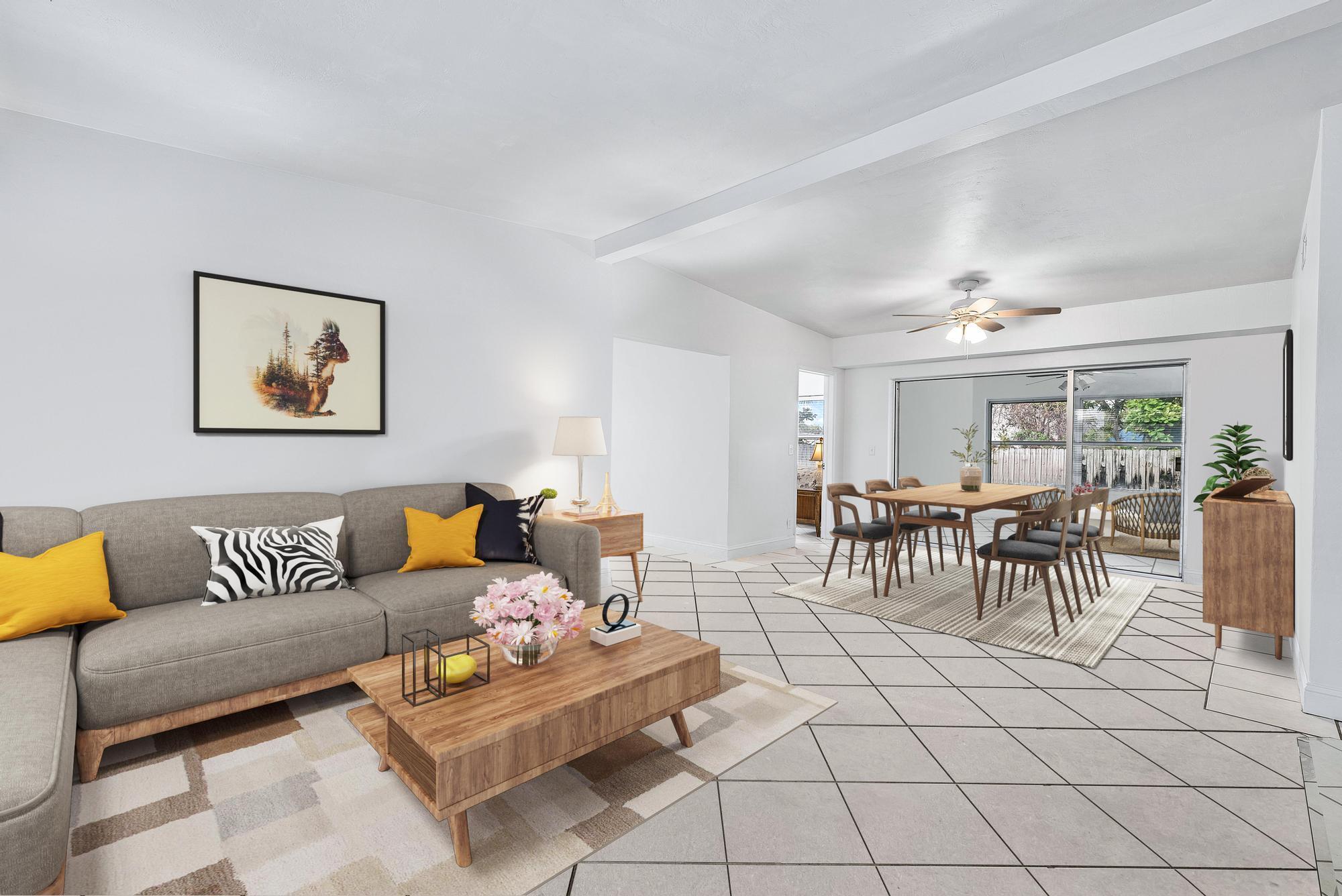 445 Monroe Drive West Palm Beach, FL 33405 - Photo 2 of 20 a living room with furniture and a dining table with potted plant