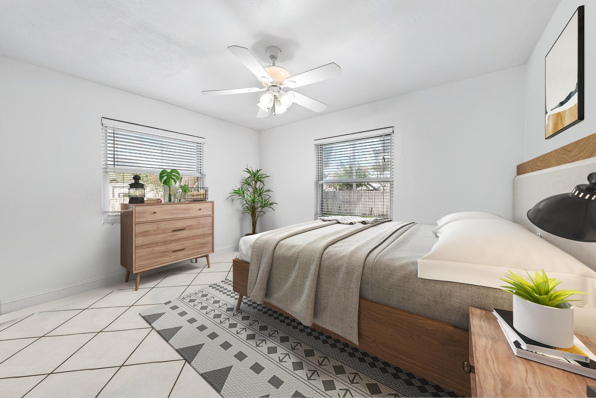 445 Monroe Drive West Palm Beach, FL 33405 - Photo 9 of 20 a bedroom with a bed and a window