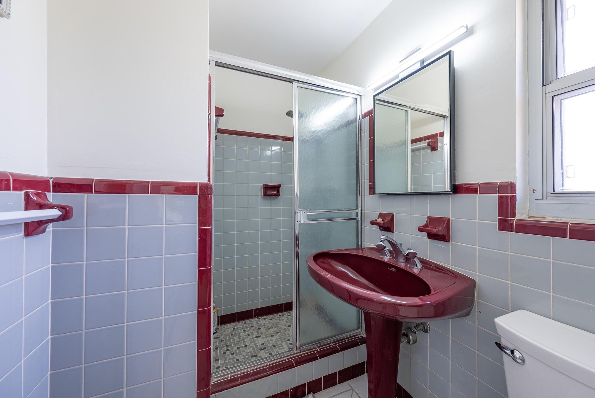 445 Monroe Drive West Palm Beach, FL 33405 - Photo 10 of 20 a bathroom with a sink a toilet and shower