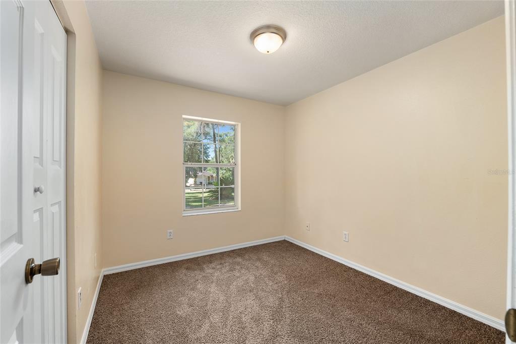 4329 Northwest 155th Street Reddick, FL 32686 - Photo 36 of 52 an empty room with a window