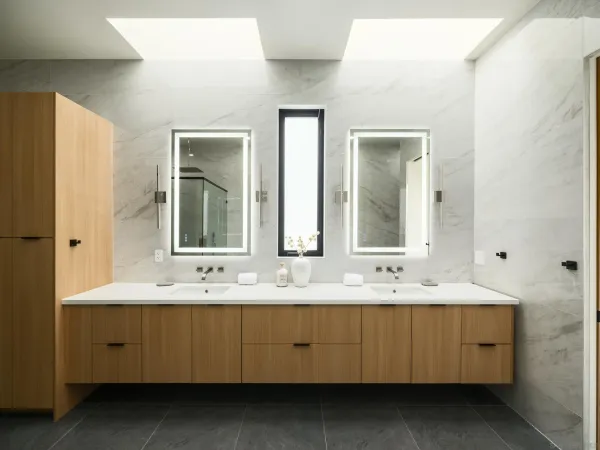 a bathroom with a double vanity sink mirror and double