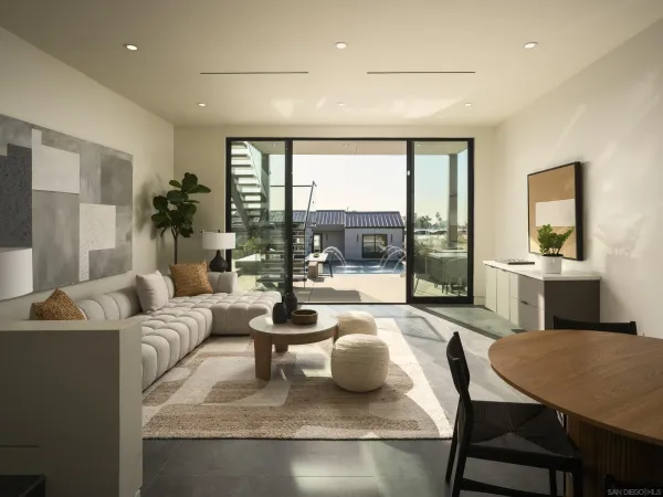 a living room with furniture and a table