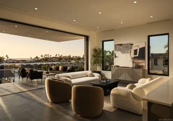 a living room with furniture and a floor to ceiling window