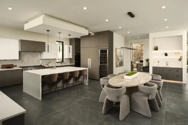 a large kitchen with a table and chairs