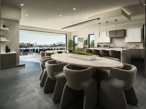a large kitchen with a table and chairs